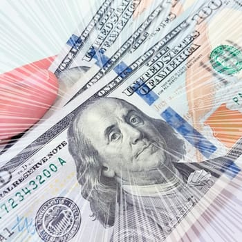 A Fan of $100 Bills.A close-up photo of a fan of $100 US dollar bills. The bills are arranged neatly, with the portrait of Benjamin Franklin visible on each bill. The background is white.Finance ve economy concept.