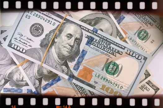 A Fan of $100 Bills.A close-up photo of a fan of $100 US dollar bills. The bills are arranged neatly, with the portrait of Benjamin Franklin visible on each bill. The background is white.Finance ve economy concept.