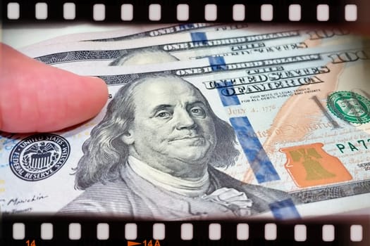 A Fan of $100 Bills.A close-up photo of a fan of $100 US dollar bills. The bills are arranged neatly, with the portrait of Benjamin Franklin visible on each bill. The background is white.Finance ve economy concept.