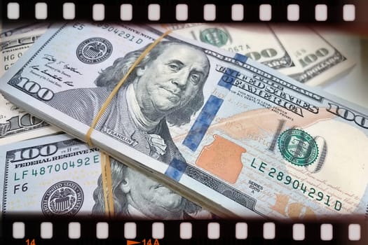 A Fan of $100 Bills.A close-up photo of a fan of $100 US dollar bills. The bills are arranged neatly, with the portrait of Benjamin Franklin visible on each bill. The background is white.Finance ve economy concept.