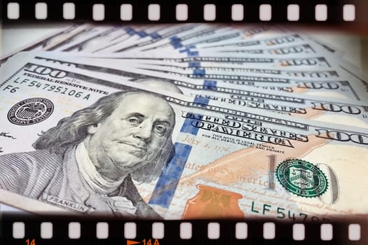 A Fan of $100 Bills.A close-up photo of a fan of $100 US dollar bills. The bills are arranged neatly, with the portrait of Benjamin Franklin visible on each bill. The background is white.Finance ve economy concept.