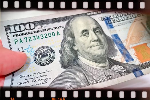 A Fan of $100 Bills.A close-up photo of a fan of $100 US dollar bills. The bills are arranged neatly, with the portrait of Benjamin Franklin visible on each bill. The background is white.Finance ve economy concept.