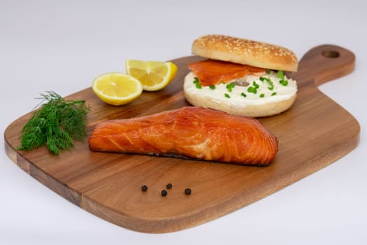 A truly delicious salmon bagel, beautifully served with fresh dill and zesty lemon, perfect for a gourmet meal