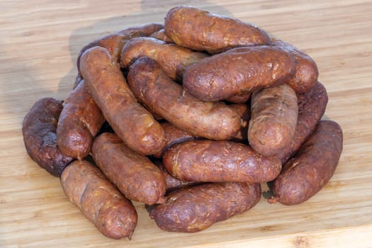 This is a delightful and appetizing assortment of freshly made sausages, ideal for grilling or savoring a hearty meal