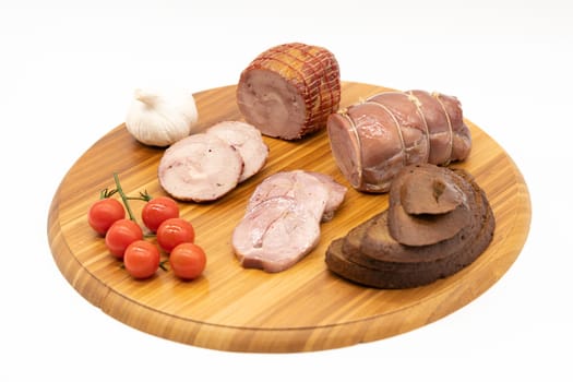 Smoked and baked Turkey roll with herbs on a wooden background.