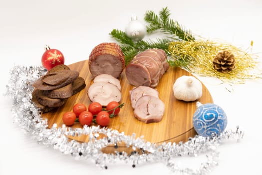 Smoked and baked turkey roll with herbs on a Christmas wooden background.