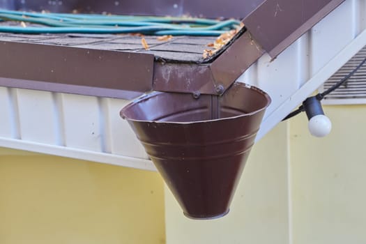 Gutter and downpipe on the roof of the building. drainage.private home.
