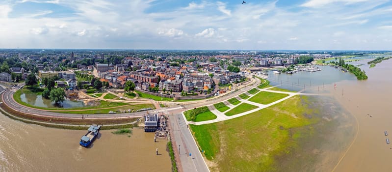 Aerial panorama from the town Tiel at the river Waal in a flooded landscape in the Netherlands