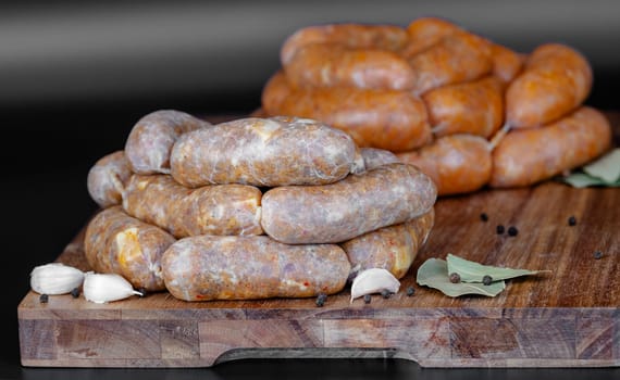 A colorful display of gourmet sausages on a rustic wooden board, garnished with spices to enhance flavor