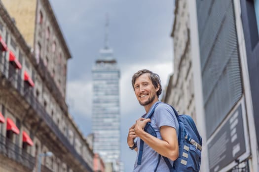Male tourist exploring Latin American Tower in Mexico City. Iconic skyscraper, historic architecture, and urban exploration.