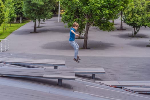 Teenage boy doing parkour in a park. Adventure, movement, and urban sport concept.