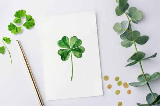 Minimalist st. patrick's day card featuring a green shamrock design on a white background, adorned with subtle gold accents. the scene includes eucalyptus leaves and golden confetti, emphasizing modern elegance and simplicity.