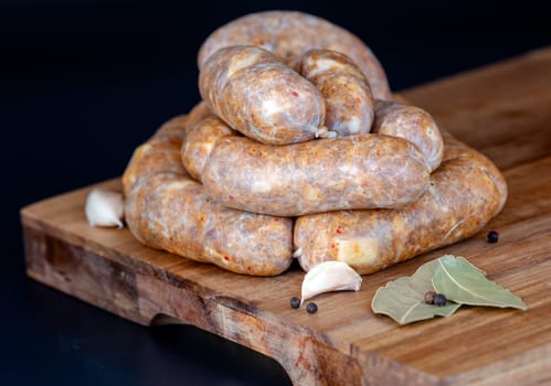 A colorful display of gourmet sausages on a rustic wooden board, garnished with spices to enhance flavor