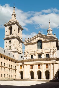 Facade of the Basilica of the Royal Monastery of San Lorenzo del Escorial. Community of Madrid, Spain. Vertical photo