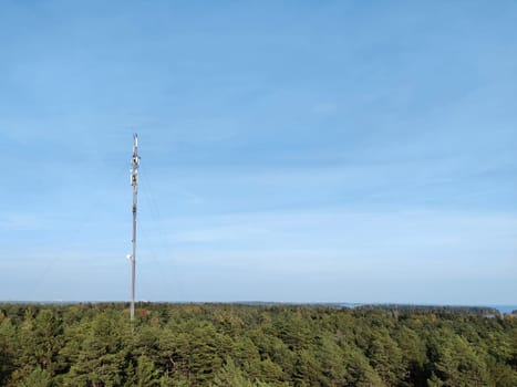 Espoo, Finland, September 24th, 2024 - mobile phone tower in pine Finnish forest