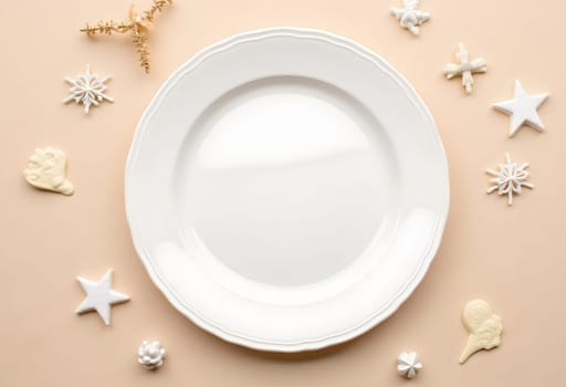 A simple white plate encircled by festive Christmas decorations, including ornaments, pine branches, and sparkling holiday lights, creating a classic and elegant holiday setting. Perfect for festive table designs and seasonal projects