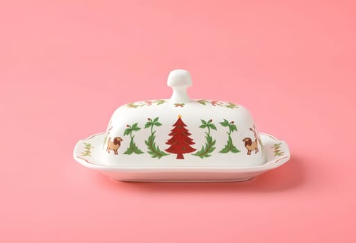 A festive Christmas-themed butter dish adorned with holiday decorations, perfect for adding a seasonal touch to your table setting. Ideal for holiday gatherings and decorative designs