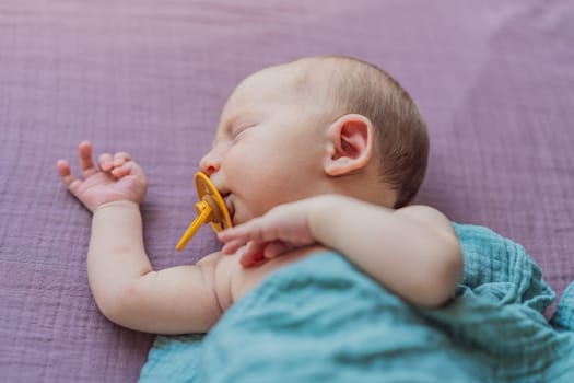 The baby is sleeping peacefully in his cozy nest. Newborn photo session captures the serene innocence and warmth of early moments.
