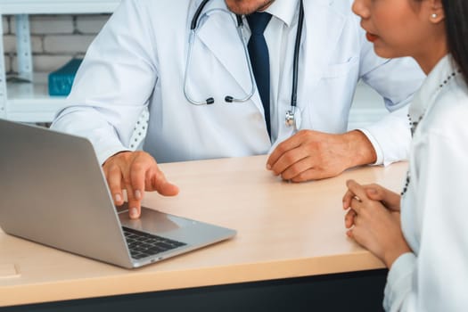 Doctor in professional uniform examining patient at hospital or medical clinic. Health care , medical and doctor staff service concept. Jivy