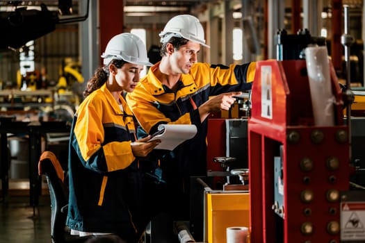 Professional quality control inspector conduct safety inspection on steel machinery and manufacturing process. Factory engineer or operator make optimization in heavy industry facility. Exemplifying