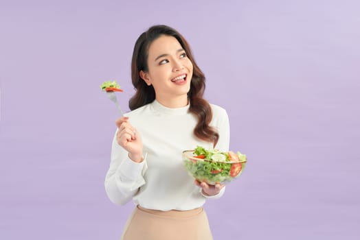 Woman in portrait, smile and eating salad, diet and healthy food with weight loss