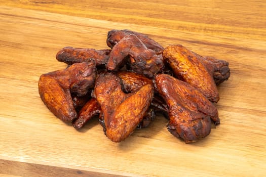 A mouthwatering and tempting pile of crispy chicken wings, perfect for appetizers or delightful game day snacks