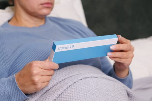 woman tests herself for new coronavirus strain at home, test for detection of covid-19 antigens and flu viruses, diagnosis of disease
