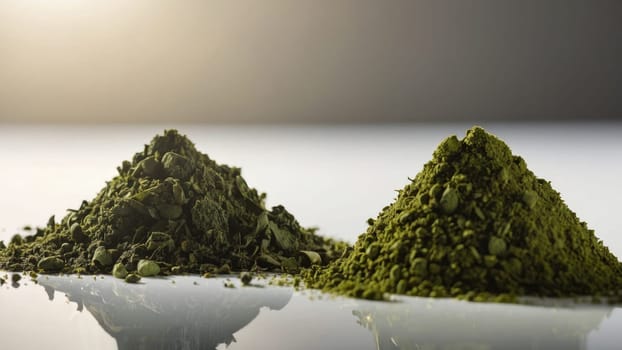 Two Piles of Bright Green Powder with Fine Texture on a Smooth White Background Surface.