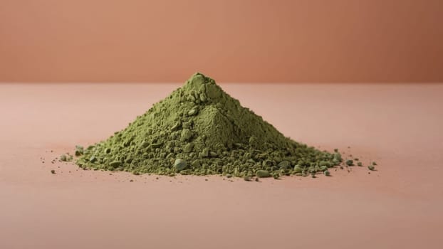 Finely Ground Vibrant Green Matcha Tea Powder Pile Isolated on Beige Background for Culinary Use.