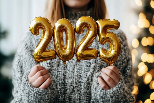 Happy new year. Portrait of a young woman holding 2025 new year gold foil balloon decoration..