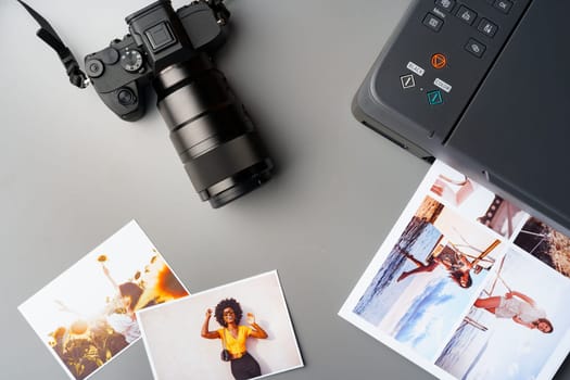 Printer and photo camera on the table. Printing photos concept