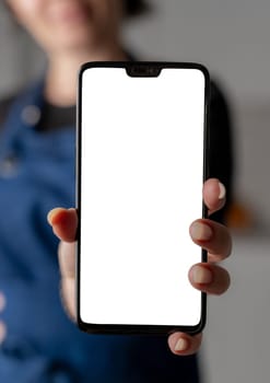 Woman In Stylish Forefront Shows Smartphone With White Screen In Close-Up View