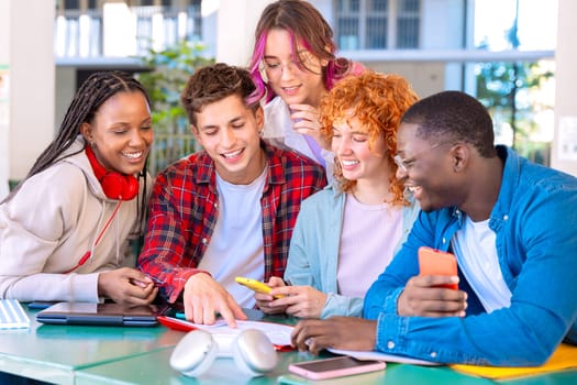 Multiracial college assignments and learning classes studying sitting around the university campus.