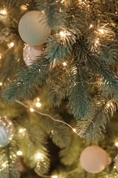Christmas balls in close-up on the Christmas tree. Decorations for Christmas trees. The concept of celebrating New Year and Christmas