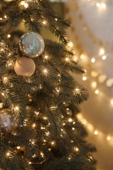 Christmas balls in close-up on the Christmas tree. Decorations for Christmas trees. The concept of celebrating New Year and Christmas