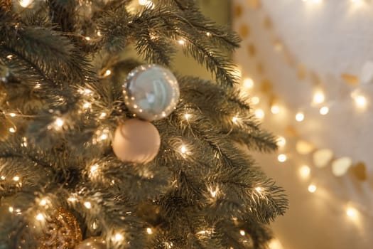Christmas balls in close-up on the Christmas tree. Decorations for Christmas trees. The concept of celebrating New Year and Christmas