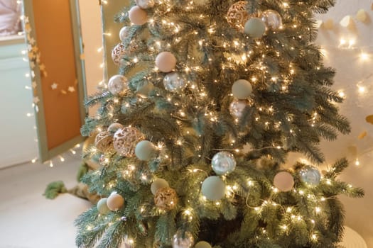 Christmas balls in close-up on the Christmas tree. Decorations for Christmas trees. The concept of celebrating New Year and Christmas