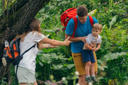 A joyful family joyfully exploring the beauty of nature together, strengthening bonds and relishing the great outdoors