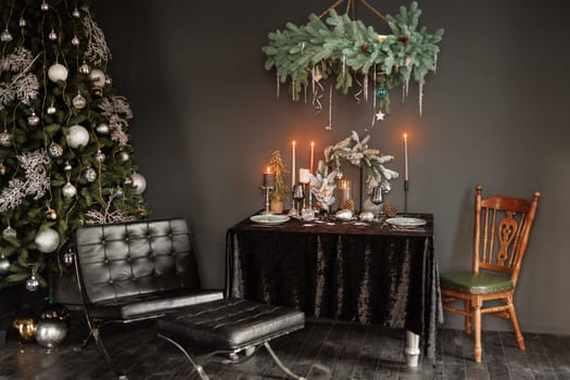 Christmas decorations with Christmas tree and garlands for the living room in dark colors