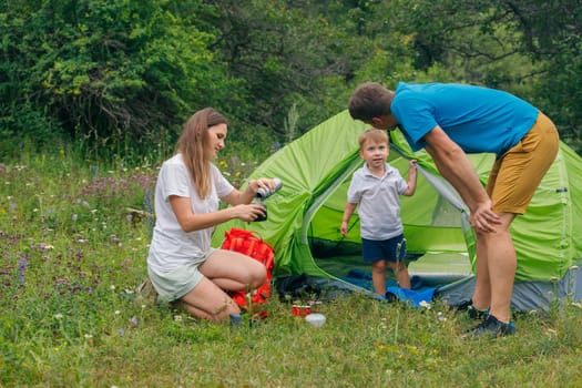 A loving family enjoys an exciting camping trip, creating unforgettable memories in the great outdoors
