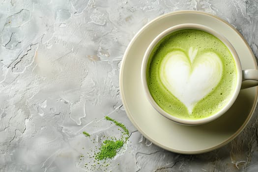 Matcha latte coffee cup with heart latte art on white background, top view with copy space