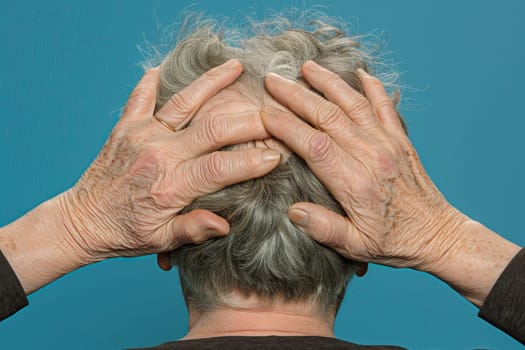 Senior woman covering bold spots on her head with hands
