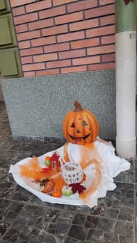 halloween, orange pumpkin, holiday decorative elements, autumn maple leaves decoration symbol objects. High quality photo