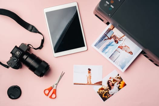 Printer, photo camera and digital tablet on the table. Printing photos concept