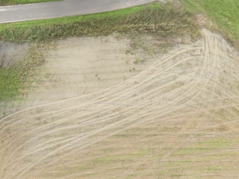 Overhead Aerial view of a flooded fields showcasing the impact of unusual heavy rainfall on rural landscapes during autumn