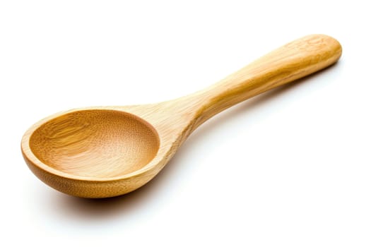 A handcrafted wooden spoon lies on a white background, highlighting its smooth texture and elegant design, ideal for cooking or serving.