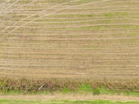 Overhead Aerial view of a flooded fields showcasing the impact of unusual heavy rainfall on rural landscapes during autumn