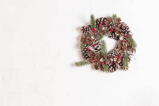Elegant christmas wreath decorated pine cones and fir trees. Christmas mood