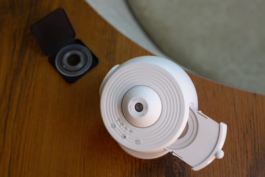 Home education, compact galaxy projector with replaceable cartridge for studying solar system, projecting images of planets and stars onto ceiling in room