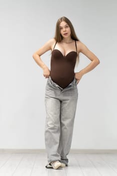positive female maternity background pregnancy expectant happy girl tummy motherhood jeans mother